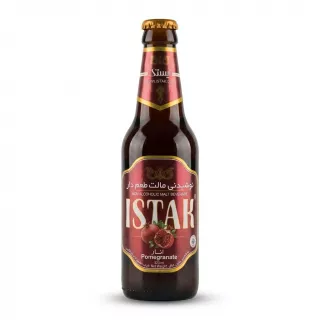 A 320ml glass bottle of Istak Pomegranate Non Alcoholic Malt Beverage is centered on a clean white background. It features a maroon and gold label with images of fresh pomegranates and the product name in large English and Arabic text.