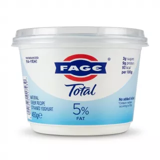Enhanced FAGE Total 5% Greek yoghurt 450g tub held in hand above store shelf