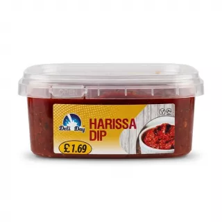 Enhanced Deli Day Harissa Dip 200g tub held in hand with price label