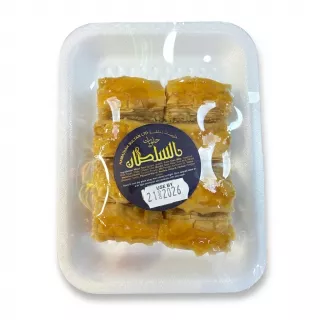 Packaged tray of Hamadia Sultan baklava selection with visible ingredients and price label