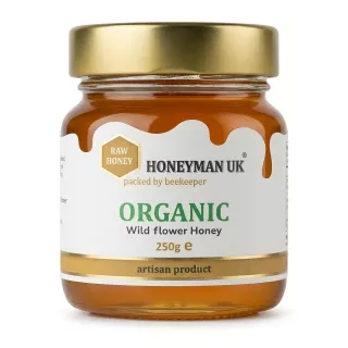 Front view of Honeyman UK Organic Wild Flower Honey 250g jar with gold lid
