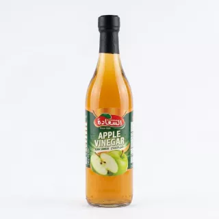 Front view of Alsaadah Apple Vinegar 500ml glass bottle on a store shelf