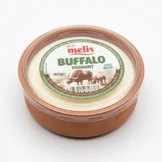 Hand holding Melis Buffalo Yoghurt 400g container in a shop aisle