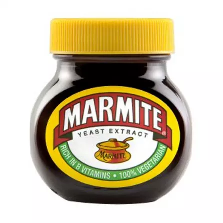 Marmite, the iconic British savory spread made with yeast extract. Spread it thin on toast for a delicious and nutritious breakfast rich in B vitamins. Explore its unique umami flavor.