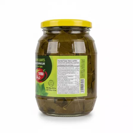 Close-up of nutritional facts and storage information on grape leaves jar