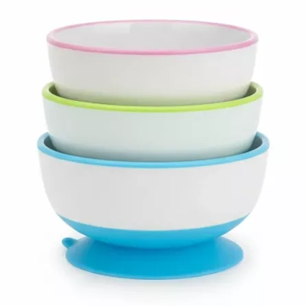 Three stacked Munchkin Stay Put suction bowls with pink, green, and blue rims
