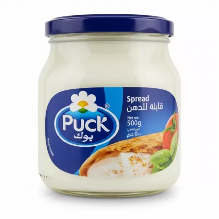 Jar of Puck Cheese Spread with blue lid