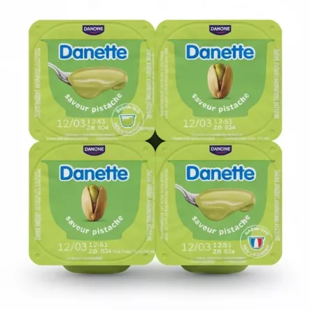 Four-pack of Danette pistachio cream dessert cups with green lids