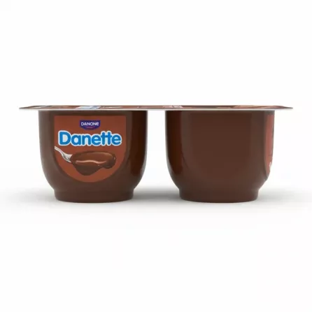 Hand holding two Danette chocolate dessert cups side view showing product branding