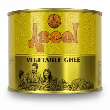 Ascol Vegetable Ghee 500ml golden tin held in hand