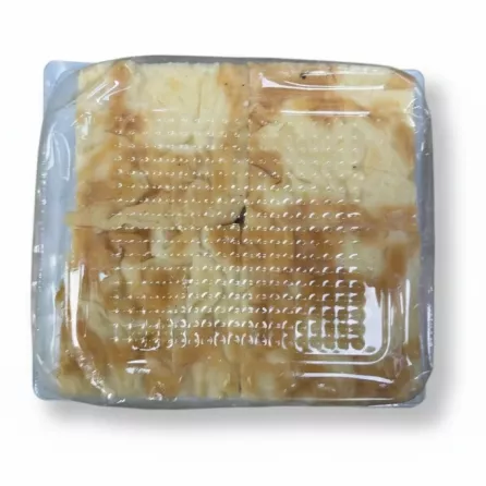 Close-up view of Yayla Peynirli Su Böreği cheese pastry inside sealed tray