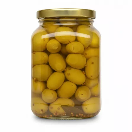 Side view of jar showing large cracked green olives in brine