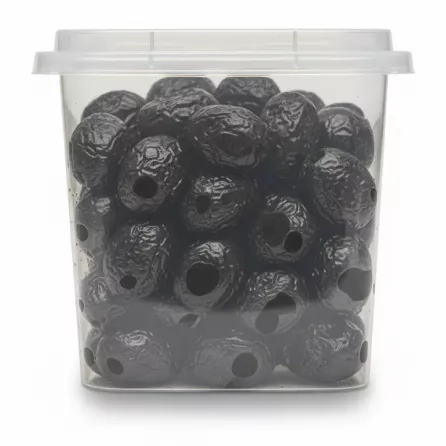 Transparent side of tub showing dark dried black olives inside