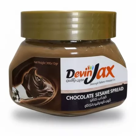 Jar of DevinJax Chocolate Sesame Spread in hand