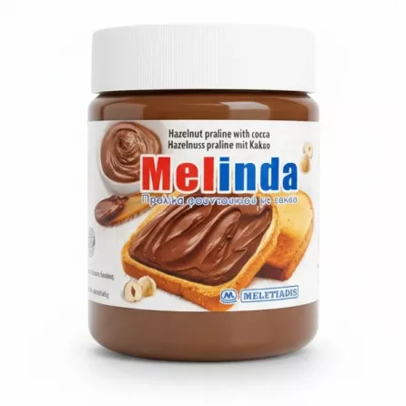 Jar of Melinda Hazelnut Praline with Cocoa spread in hand