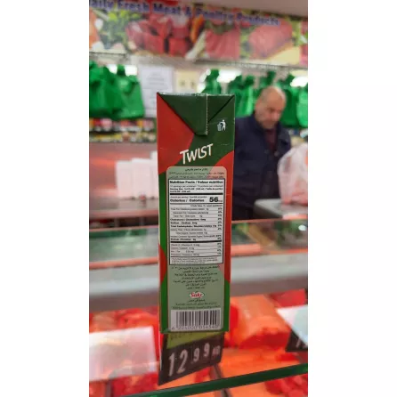 Back view showing nutritional facts and barcode on Twist Mango Nectar