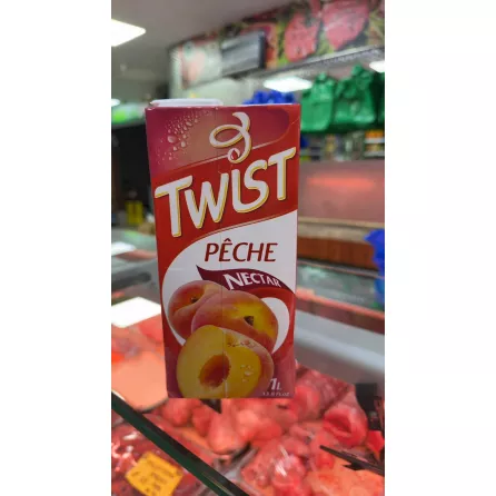Side view of Twist Peach Nectar carton with French label