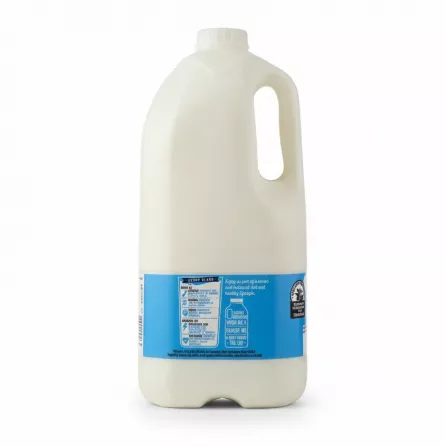 4 pint bottle of Sainsbury's whole milk with blue label showing nutrition information
