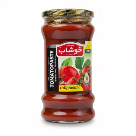 Glass jar of Khoushab tomato paste with label showing tomatoes and brand name