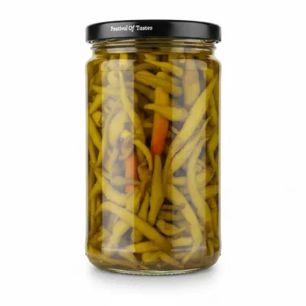Side view of jar showing pickled green peppers immersed in brine