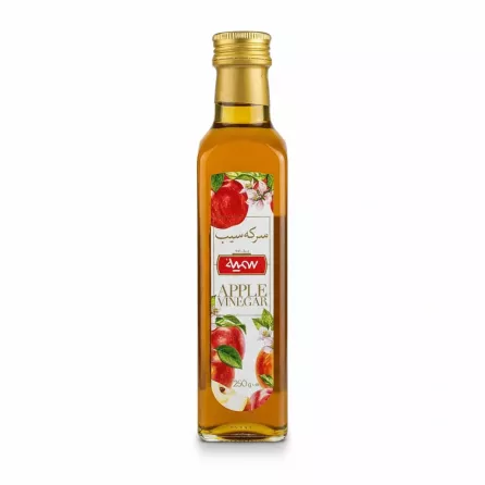 Glass bottle of Somayeh apple vinegar with apple and floral label design