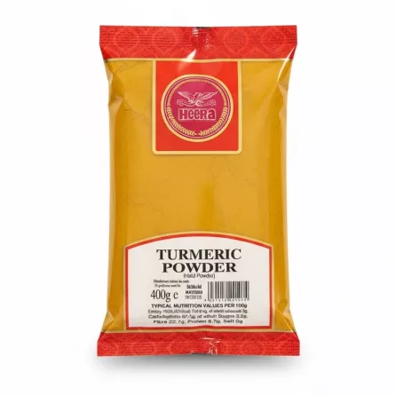 Packet of Heera turmeric powder in yellow and red packaging