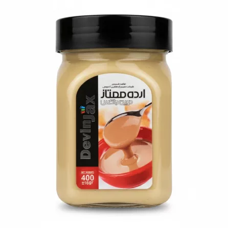 Jar of DevinJax Premium Tahini Paste showing label and black lid