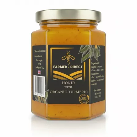 Jar of Farmer Direct honey with organic turmeric showing label front
