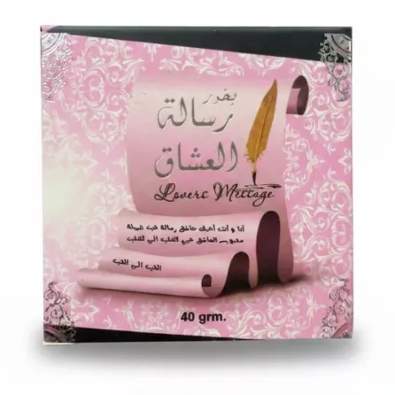 Pink box of Risalah Al Ishaq Bukhoor held in hand