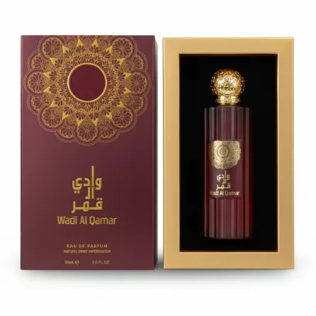 Wadi Al Qamar 90ml eau de parfum bottle in a red fluted glass with golden ornate cap inside the box