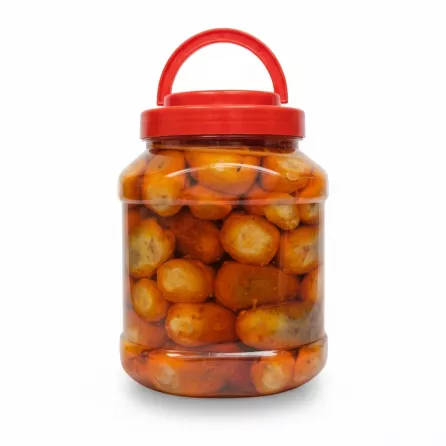 Large jar of pickled hot jalapenos with red lid and handle