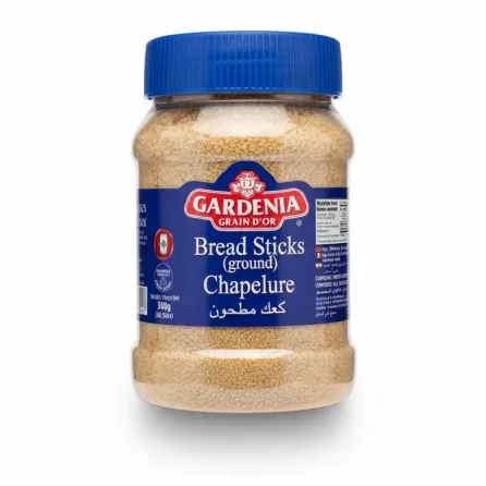 Jar of Gardenia Ground Bread Sticks with blue lid held in hand