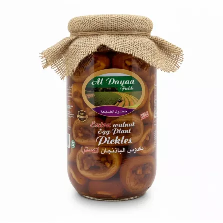 Glass jar of Al Dayaa Fields Extra Walnut Eggplant Pickles with rustic fabric lid