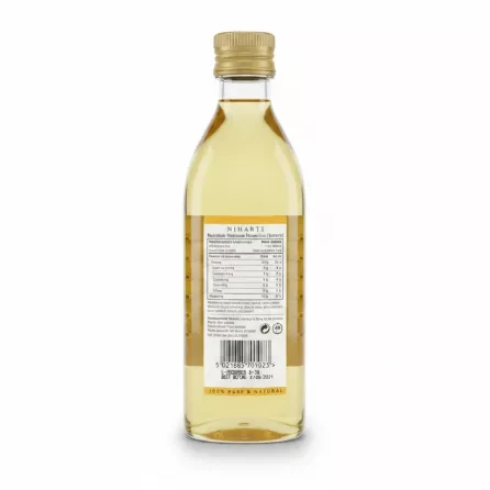Back label of Niharti Pure Almond Oil displaying nutritional facts and barcode