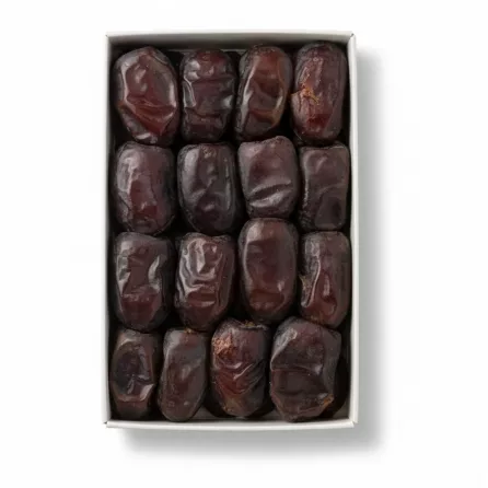 Close-up of premium Mazafati dates in box