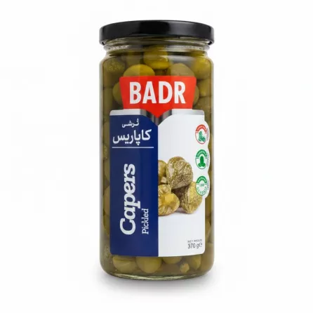 Glass jar of Badr pickled capers with red and blue label