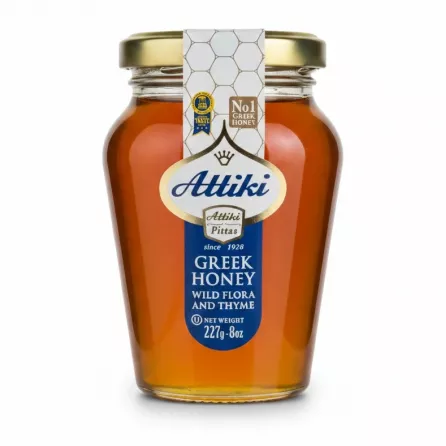 Jar of Attiki Greek Honey Wild Flora & Thyme, clear glass with golden lid