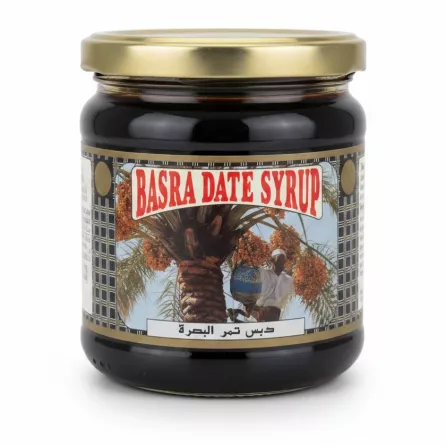 Glass jar of Basra Date Syrup with gold lid and label showing a date palm tree