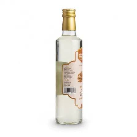 Side view of Donya Cumin Distilled Water showing label