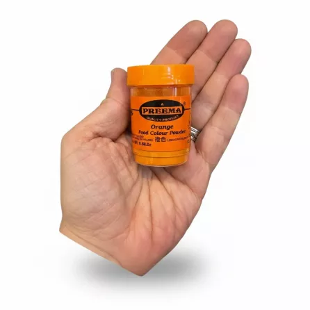 Preema Orange Food Colour Powder container held in hand front view