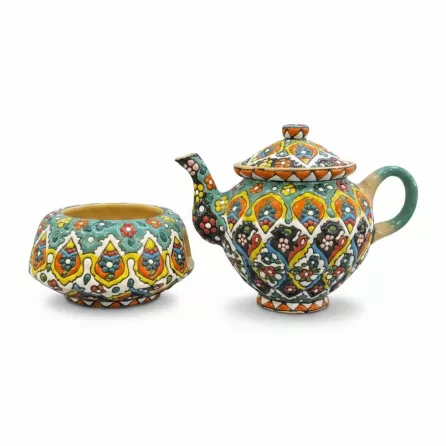 Ceramic teapot and matching warmer stand with bright traditional patterns