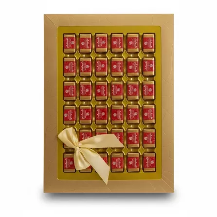 Gold box of individually wrapped Achaachi chocolates with satin bow