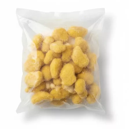Close-up view of frozen crispy breaded chicken nuggets in sealed transparent bag