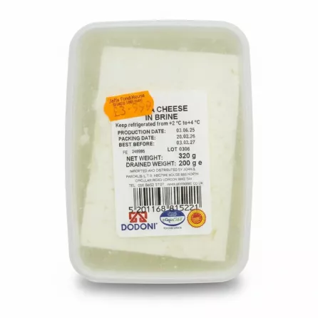 Close-up of feta cheese in brine with product label showing weight and barcode