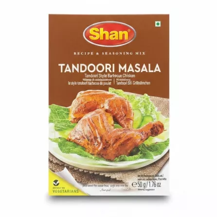 Box of Shan Tandoori Masala spice mix with grilled chicken image