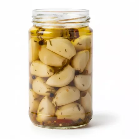 jar of whole garlic cloves pickled in herb oil