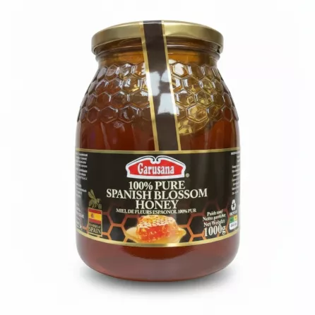 Garusana 100% pure Spanish blossom honey in a hexagonal patterned glass jar with gold lid