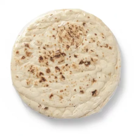 Close up of plain naan bread texture inside clear packaging