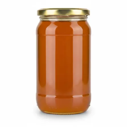 Clear golden multiflower honey in jar side view