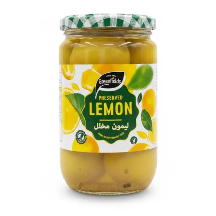 Jar of Greenfields preserved lemons with green and white checkered lid, showing whole preserved lemons in brine